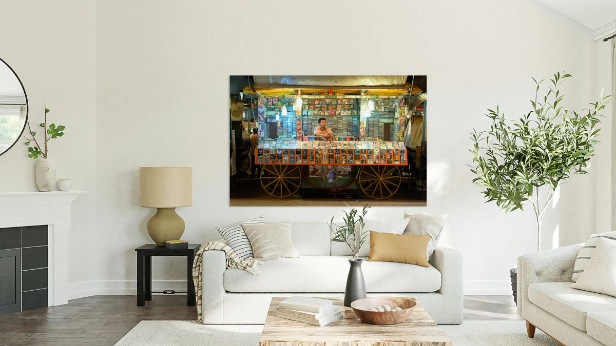 CD stall in Marrakesh at night with vendor selling music