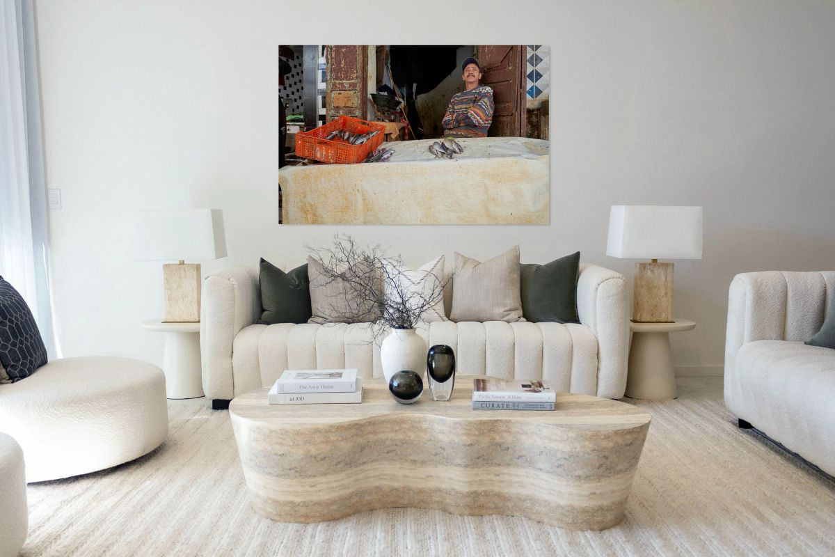 Fishmonger sits by his stall in Meknes Morocco market