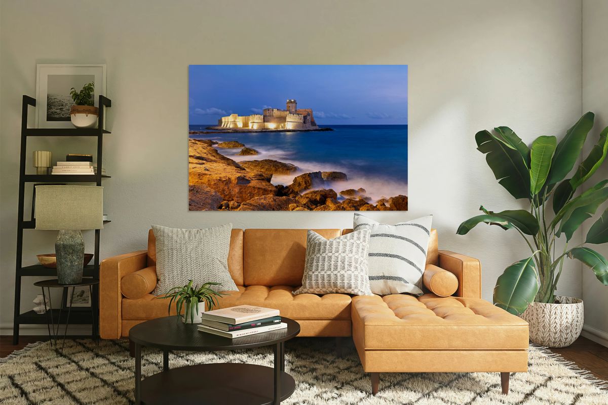 Sunset reveals Aragon castle at Le Castella in Calabria Italy