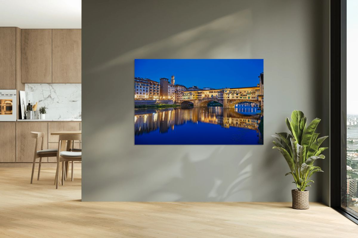 Florence Tuscany Italy view of Ponte Vecchio at sunset over Arno