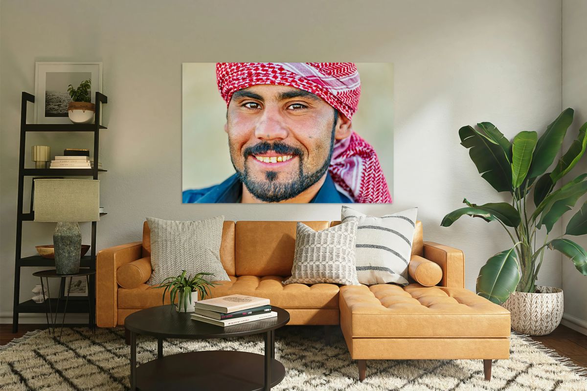 Portrait of a young man in Syria wearing a traditional headscarf