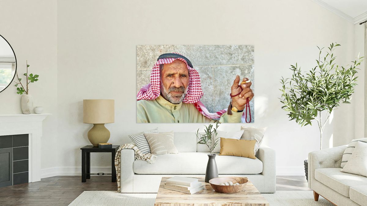 Portrait of a senior man sitting in Aleppo Syria with prayer be