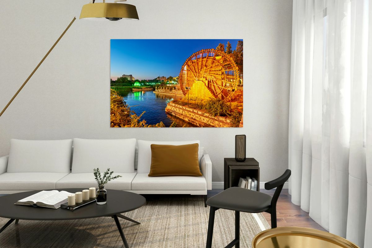 Water wheels in Hama Syria by the Orontes River at dusk