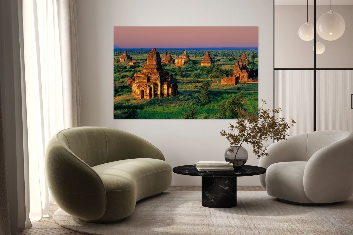 Explore temples in Bagan during sunset with green fields around