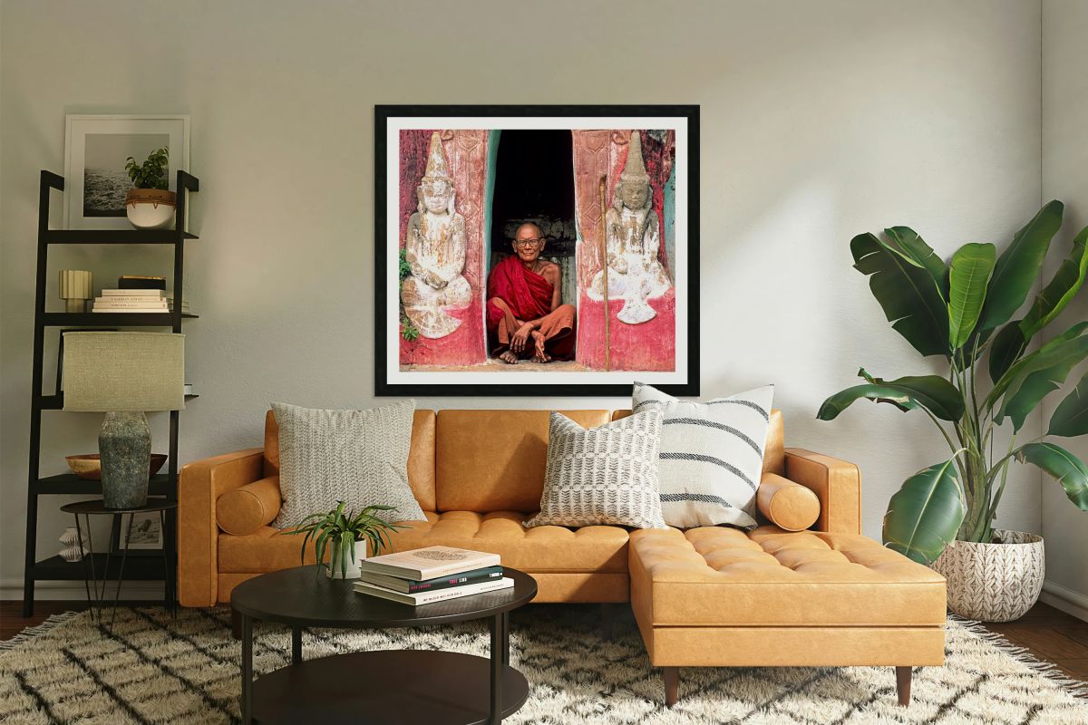 Old monk meditates in temple doorway in Myanmar