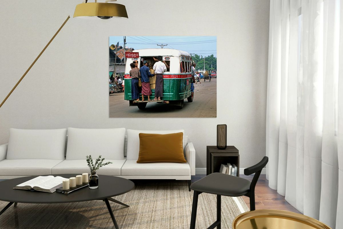 Busy bus transportation scene in Myanmar with people boarding