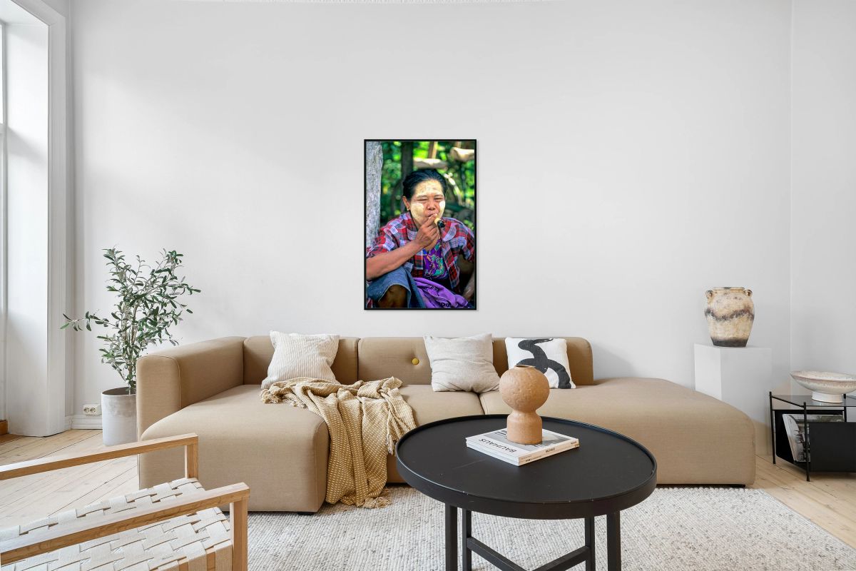 Portrait of a woman smoking in Myanmar during a sunny day