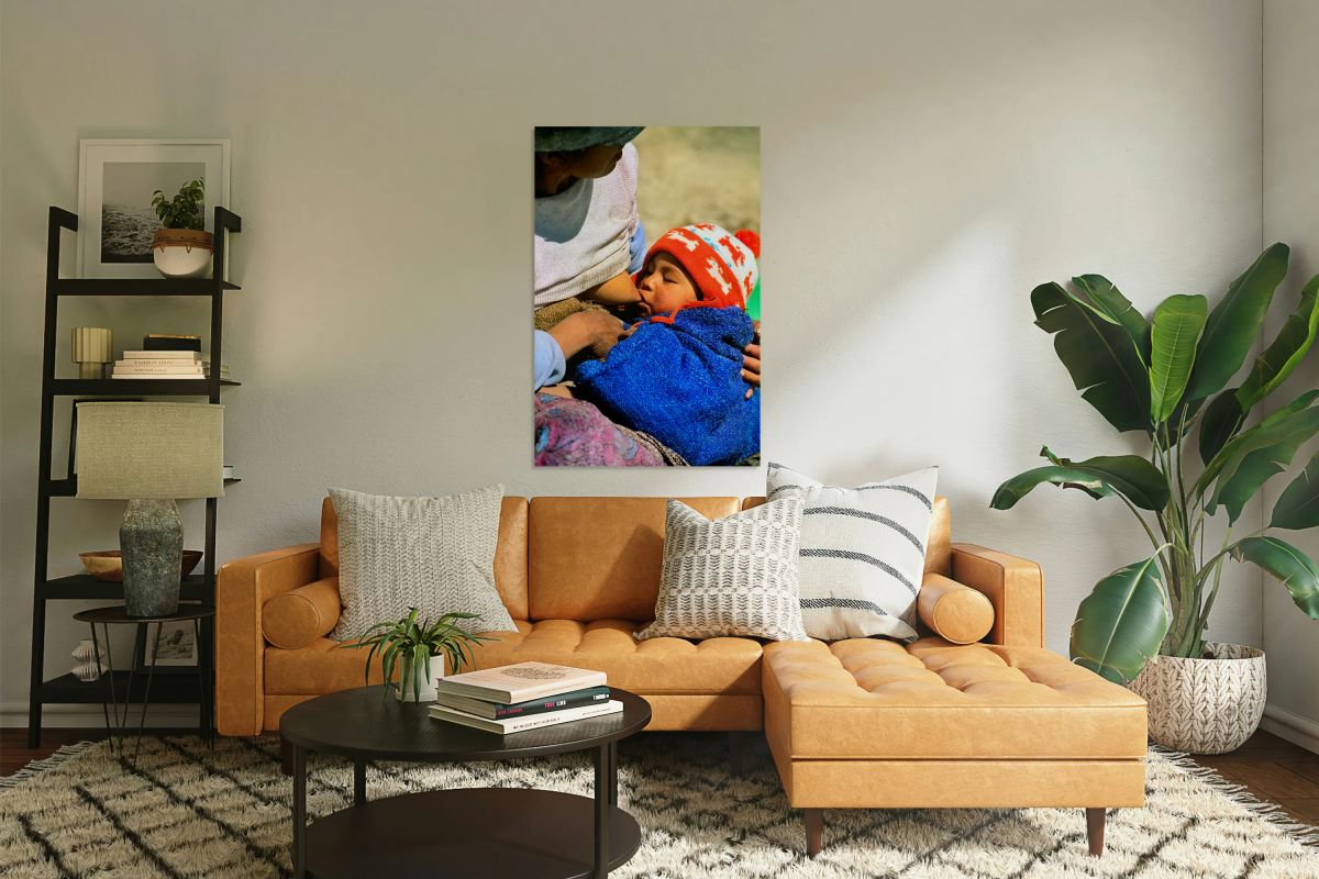 Indigenous mother nourishes child in the Andes of Argentina