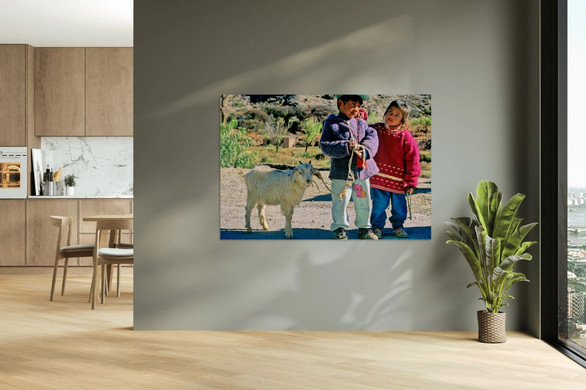 Children with a goat in a village in the Andes Mountains of Arge