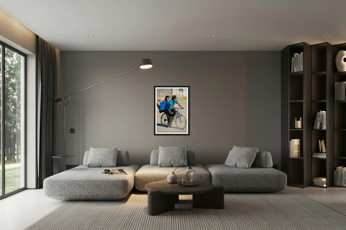 Family cycling with baby in sling.