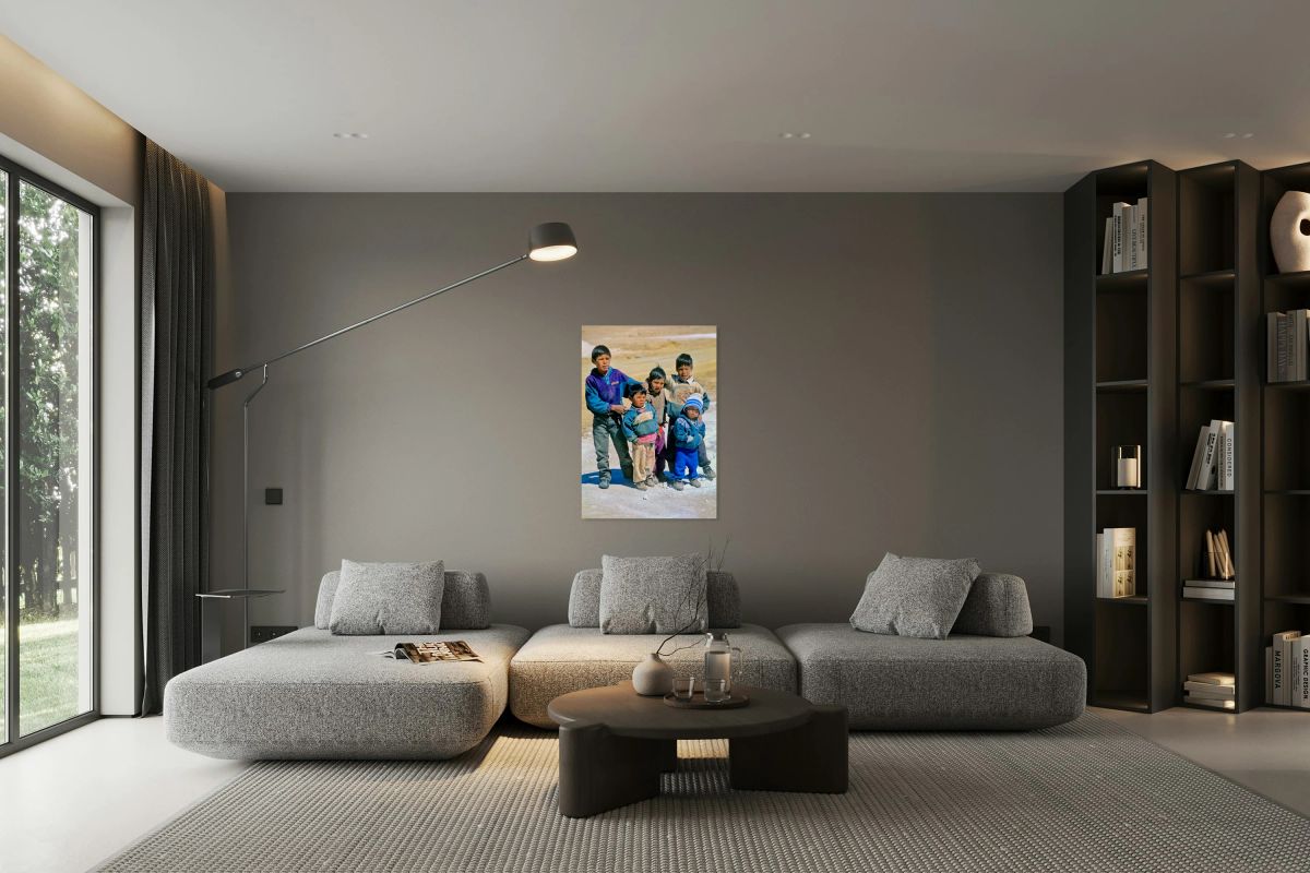 Five young boys pose together on a dirt road.