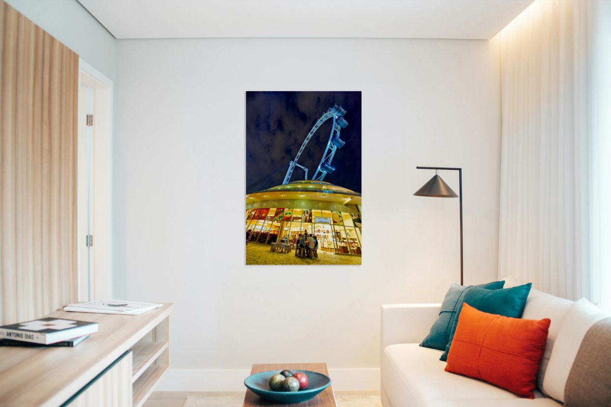 Visitors gather near Flyer in Singapore at night for city views