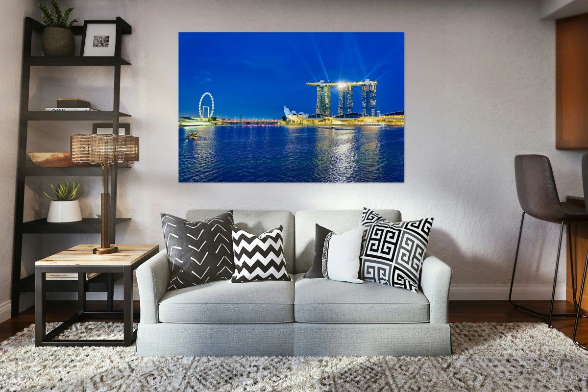 Sunset view of Marina Bay with city skyline and water reflection