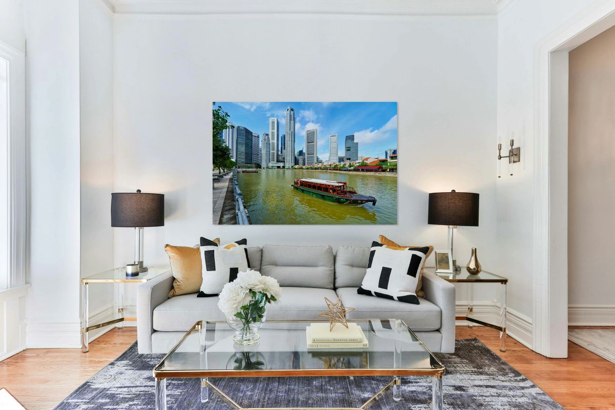People enjoy boat trip on river in downtown Singapore