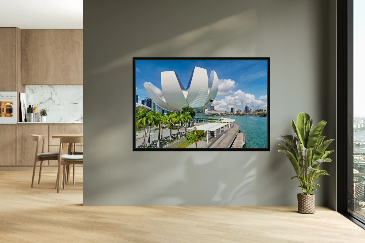 Visitors enjoy view of ArtScience Museum in Singapore near water