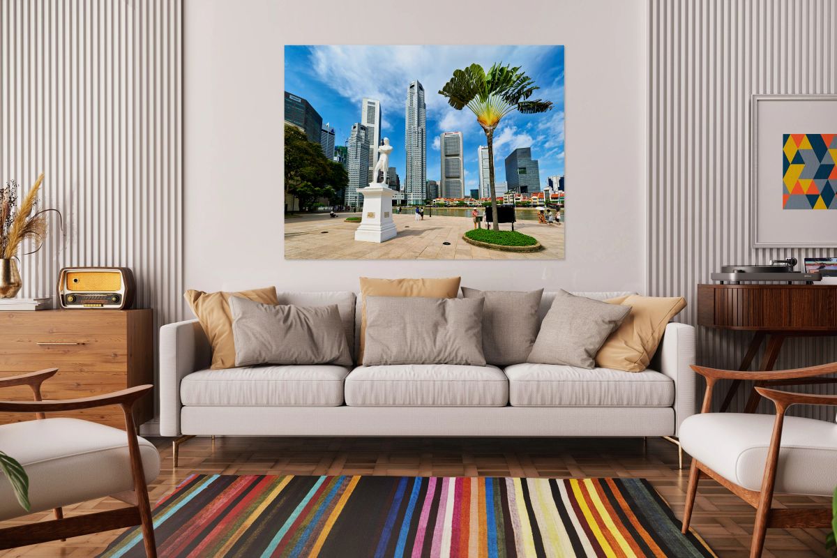 Visitors gather at Raffles landing site with city skyline in Sin