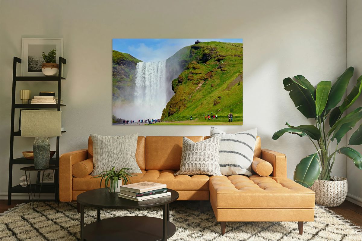 People visiting Skogafoss waterfall during daylight in Iceland