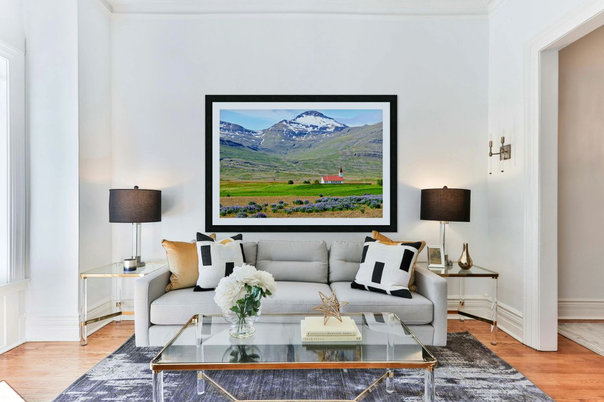 Heydalir Church in Iceland with mountains in the background