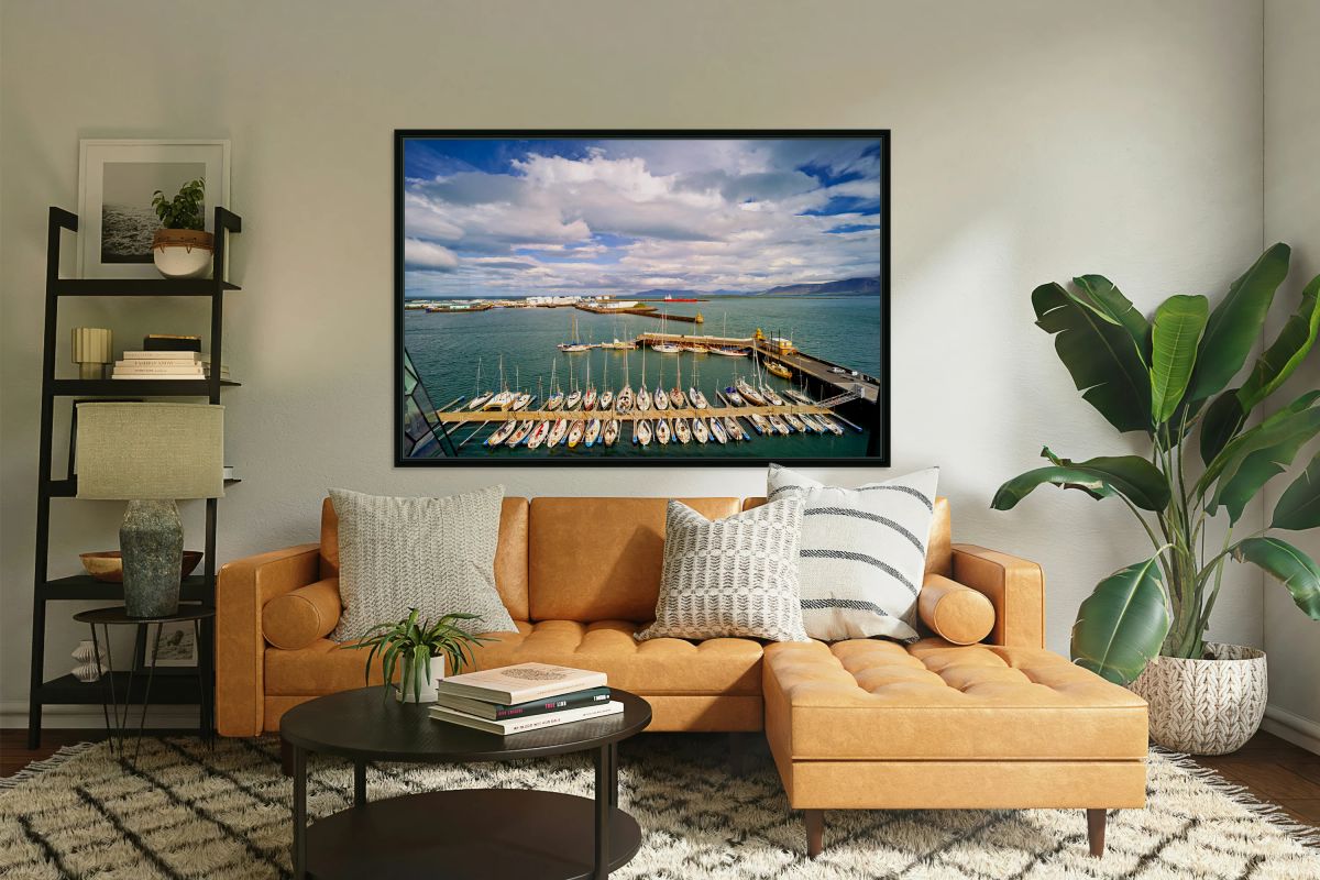 Harbor view in Reykjavik Iceland with sailing boats and clouds