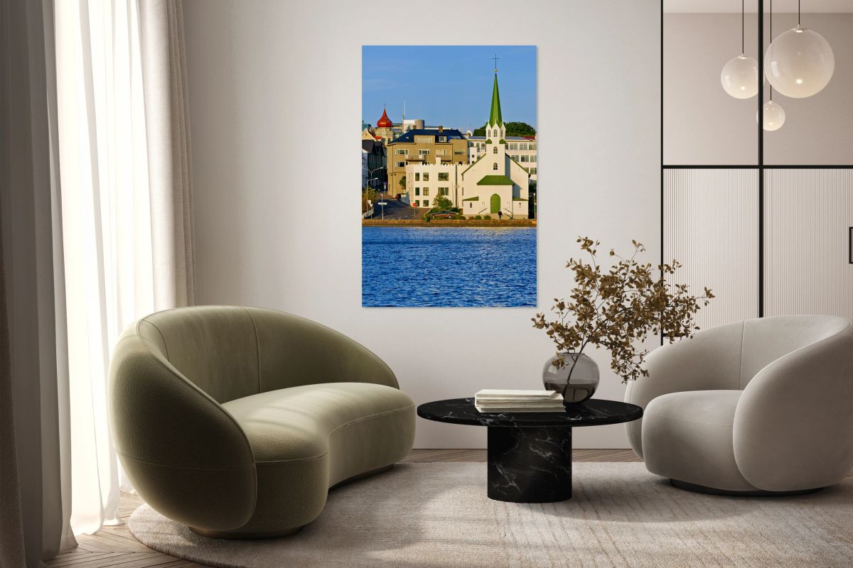 Lutheran free church by lake tjornin in reykjavik iceland