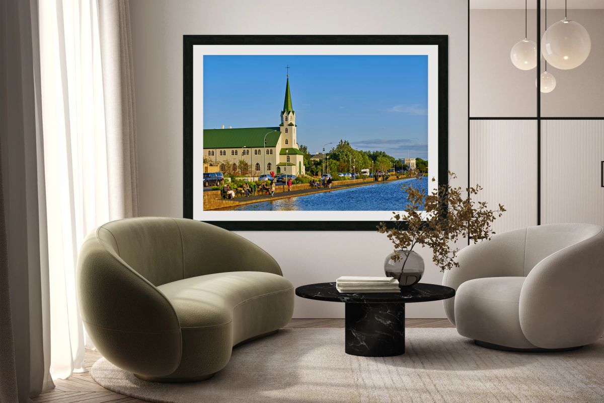 Lutheran free church by lake tjornin in reykjavik iceland