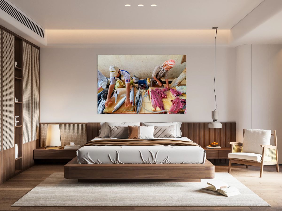 Fish market in Muscat Oman shows workers preparing fish