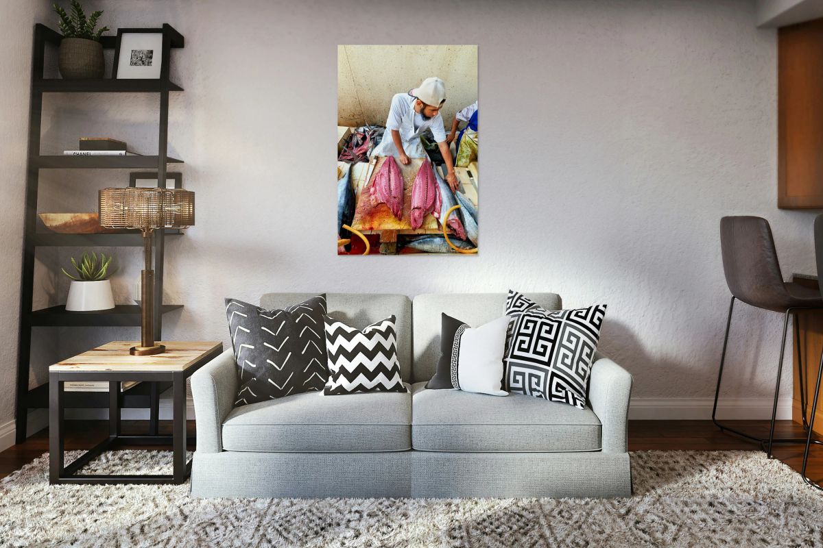 Fish market in Muscat Oman shows a vendor at work