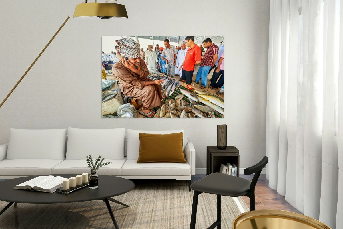 Fish market scene in Muscat Oman with vendors and buyers