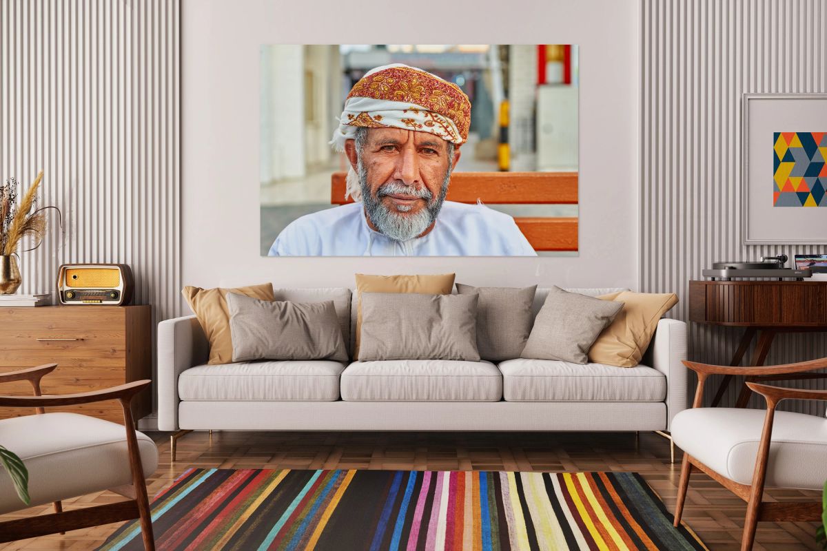 Man sitting on a bench in Muscat Oman during the day