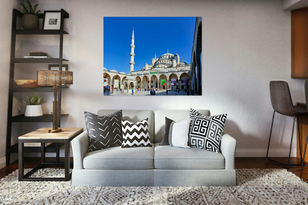 People walk around the Blue Mosque in Istanbul Turkey