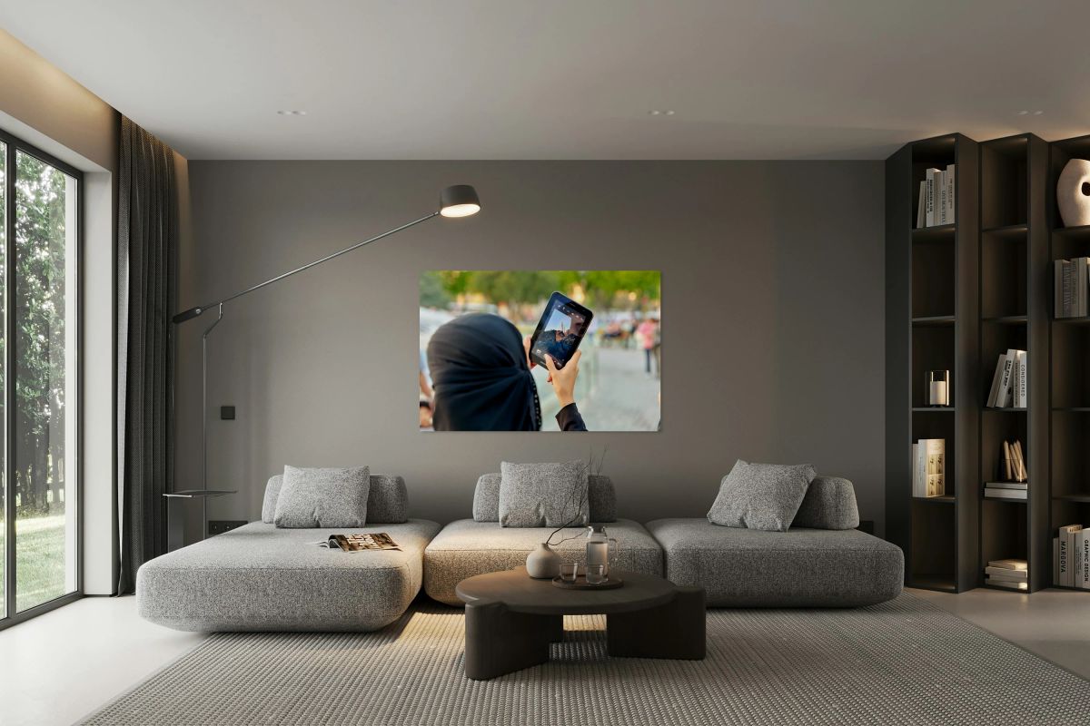 Veiled woman using a tablet in Istanbul Turkey