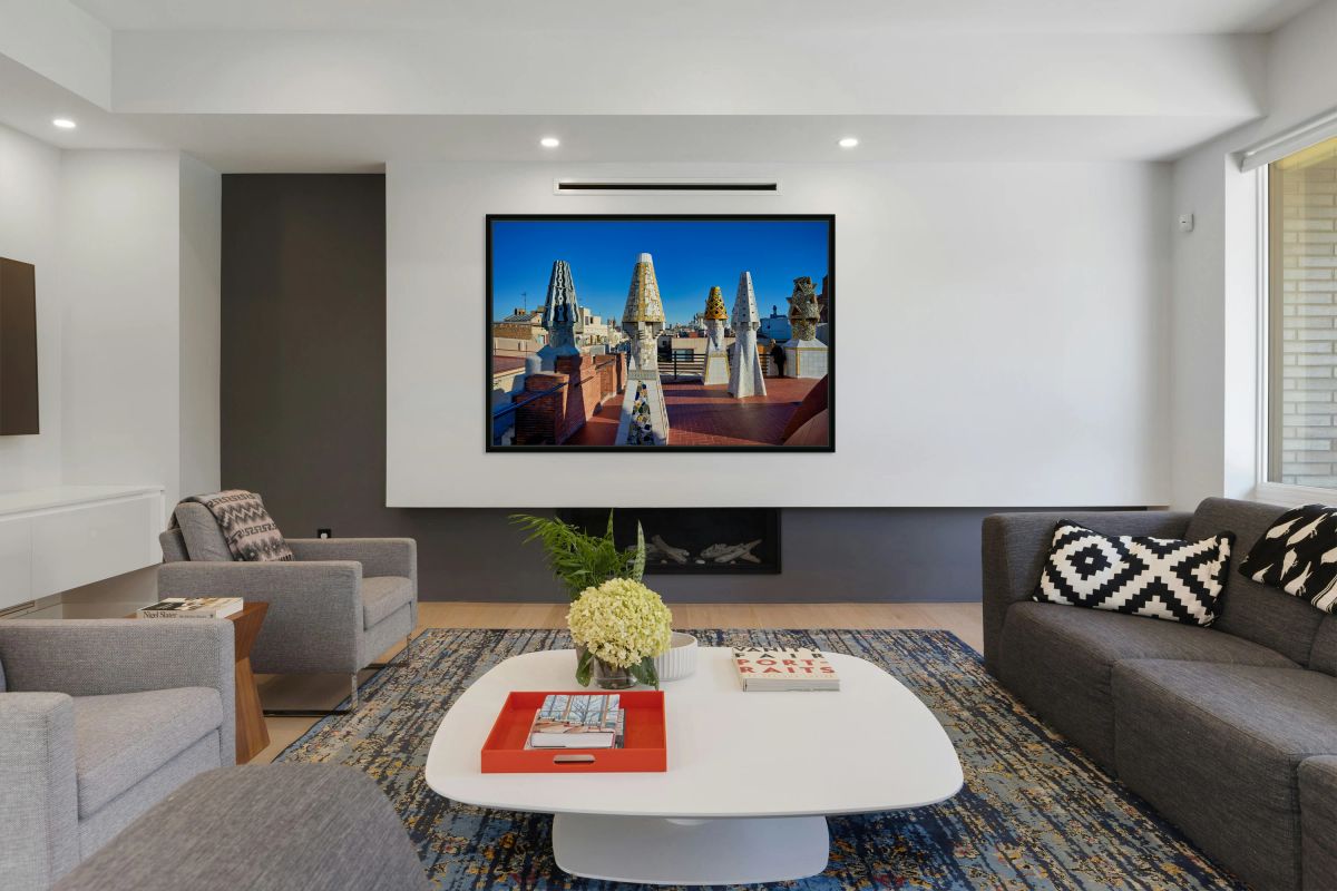 Palau Guell roof with Gaudi sculptures under clear sky