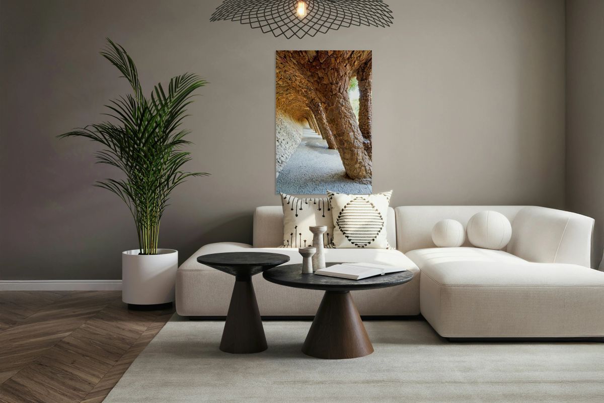 Walking through the colonnaded pathway in Park Guell Barcelona