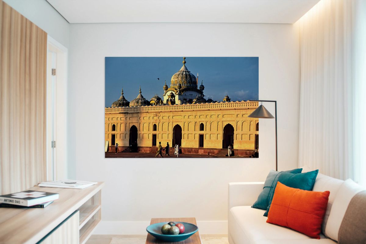 Visitors explore Badshahi Mosque in Lahore at sunset