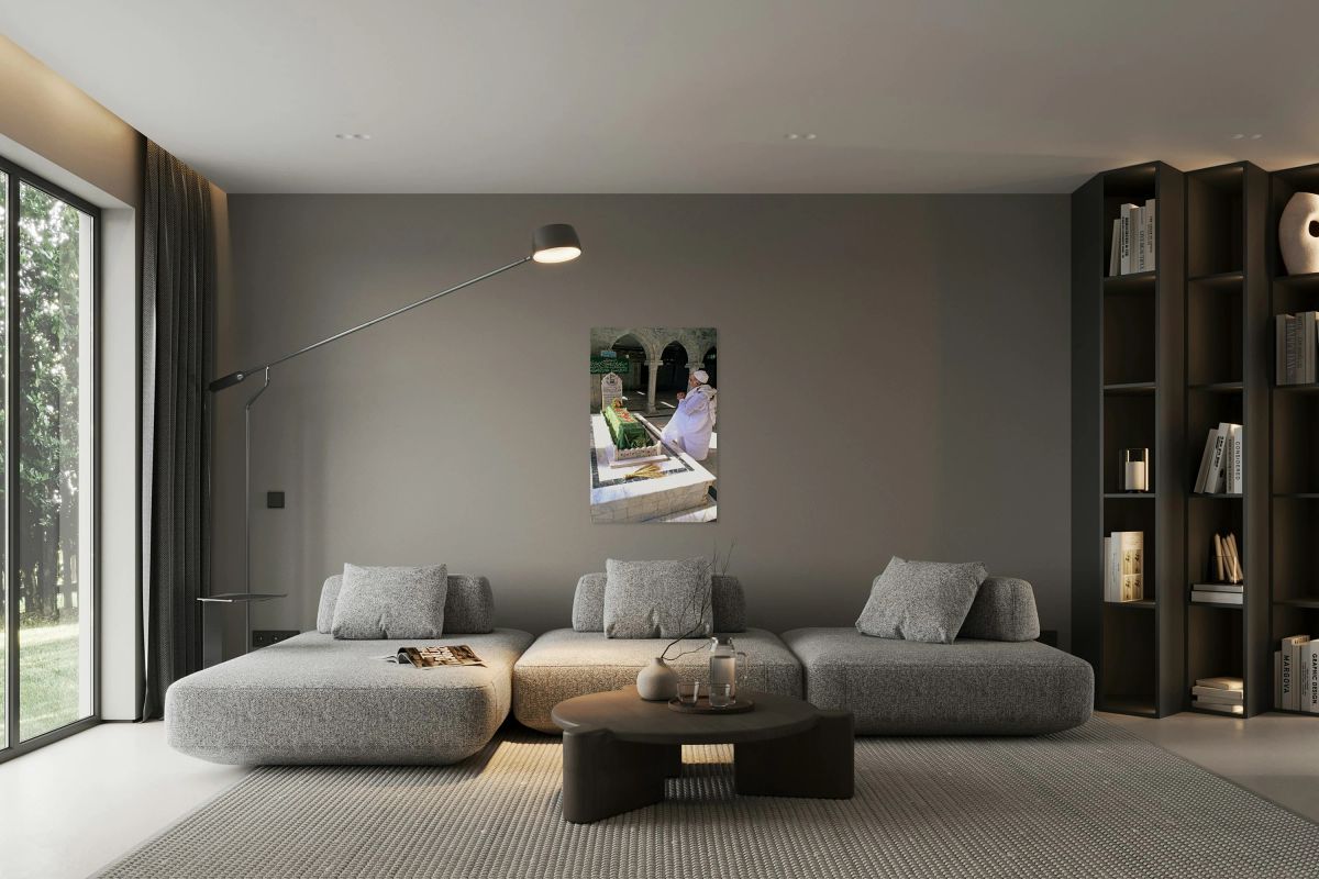 Man praying at a shrine in Pakistan during daylight hours