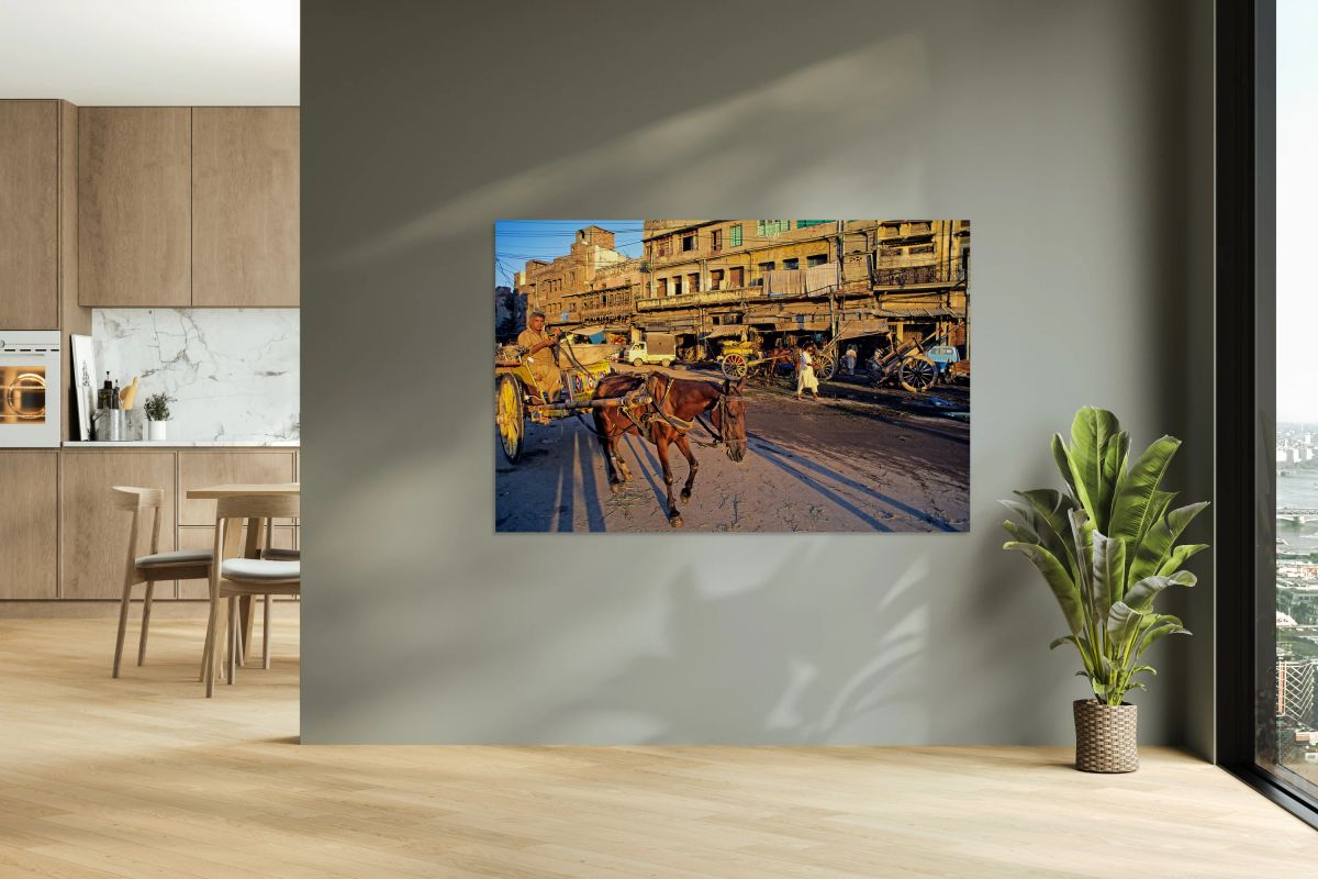 Horses and carts on the busy streets of Lahore at dusk