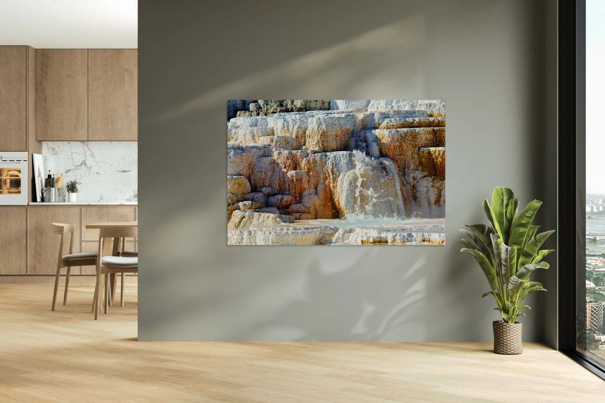 Water flowing over the terraces at Devils Thumb in Yellowstone