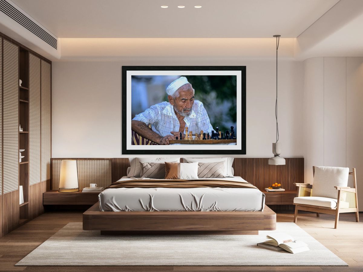 Elderly man plays chess in Bukhara Uzbekistan