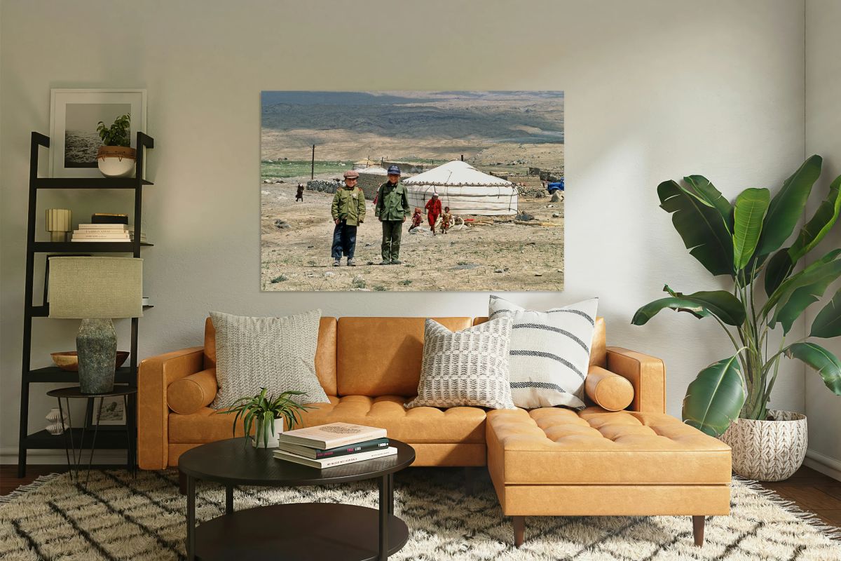 Children stand together near a yurt in an Uzbek village