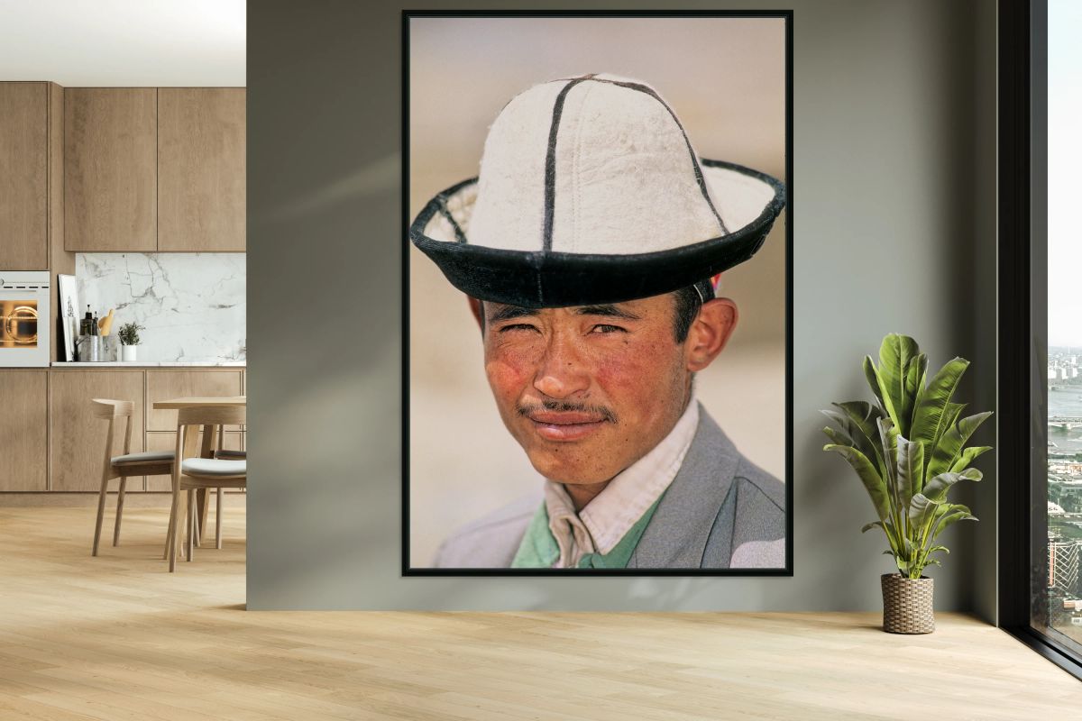 Young man in traditional hat from Uzbekistan