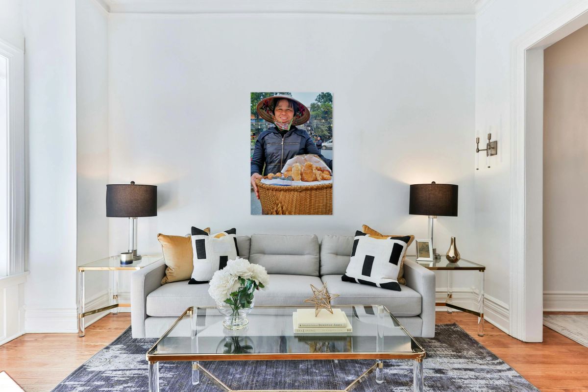 Street vendor sells snacks in Hanoi with a big smile