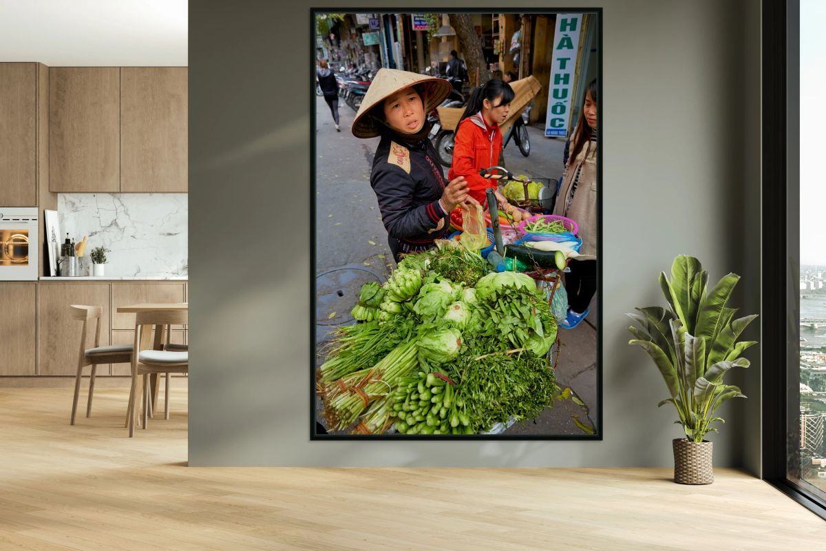 Woman sells fresh vegetables in Hanoi street market
