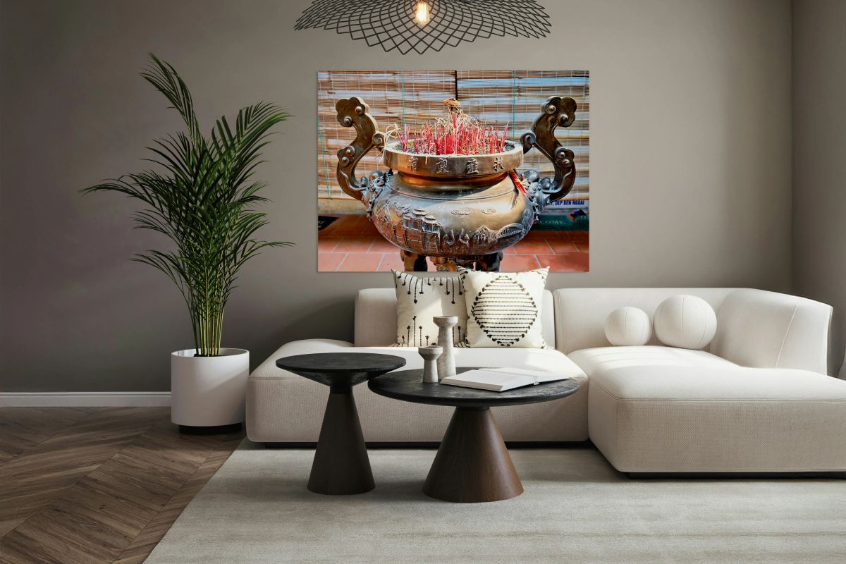 Hanoi incense burner with red sticks in a local setting