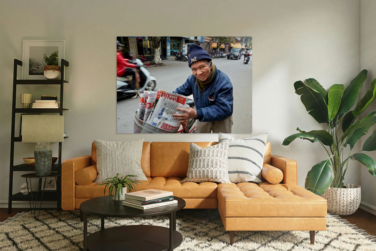 Man selling newspapers in Ho Chi Minh City