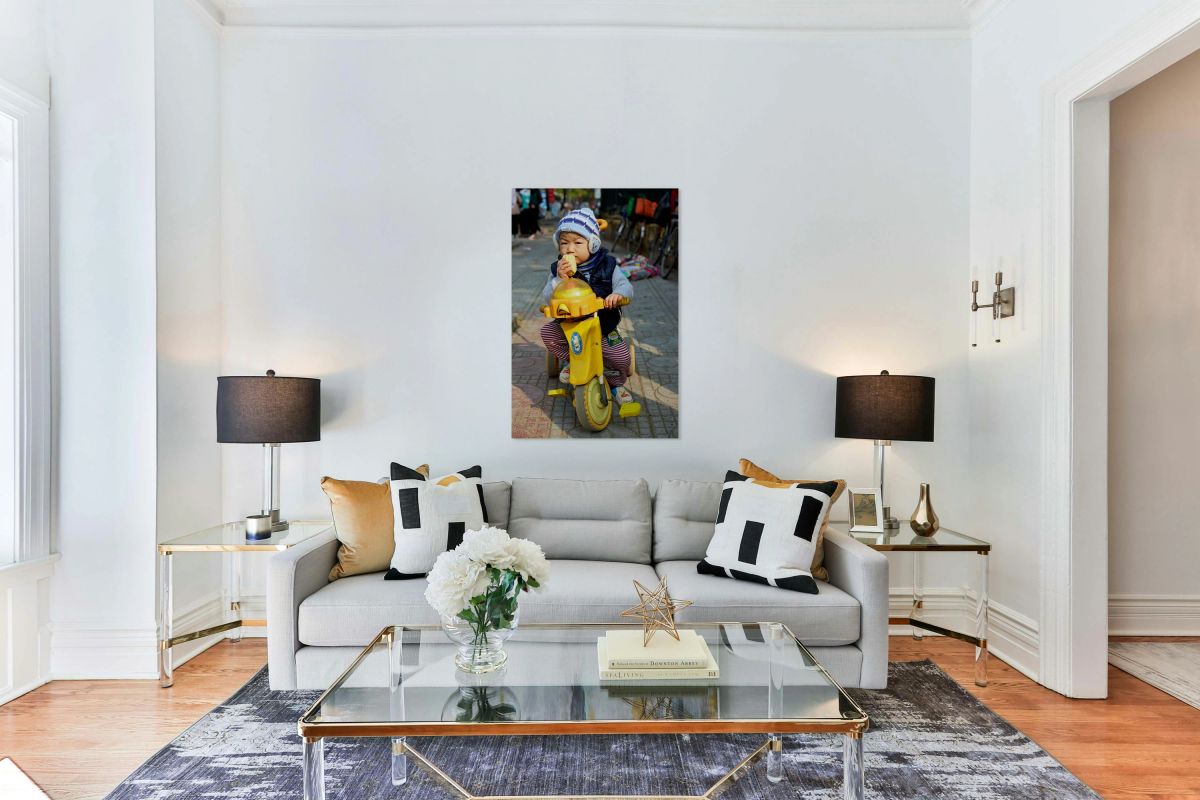 Child enjoys snack while riding tricycle in Hanoi streets