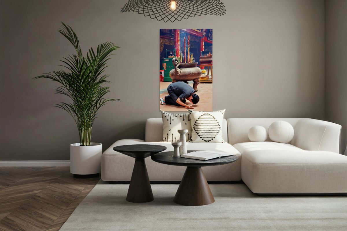 Man praying at a shrine in Ho Chi Minh City Vietnam