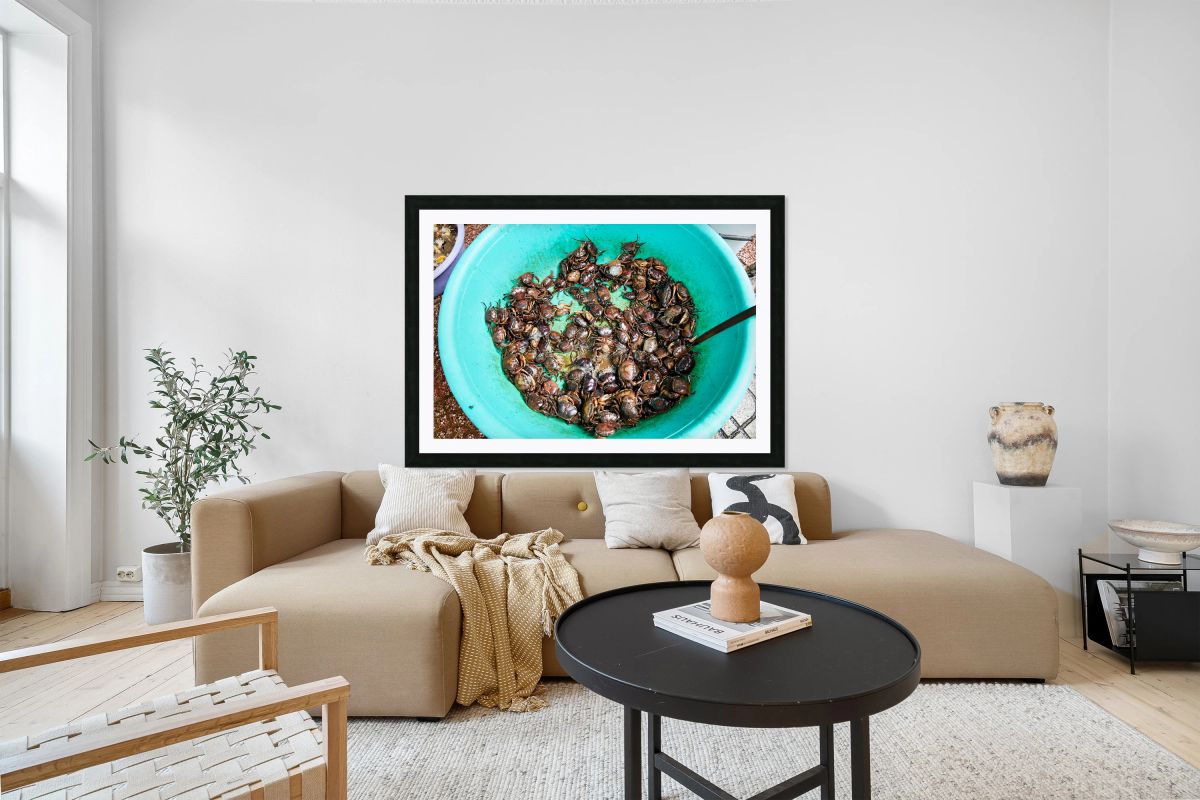 Fresh crabs in a green bowl at a market in Ho Chi Minh City