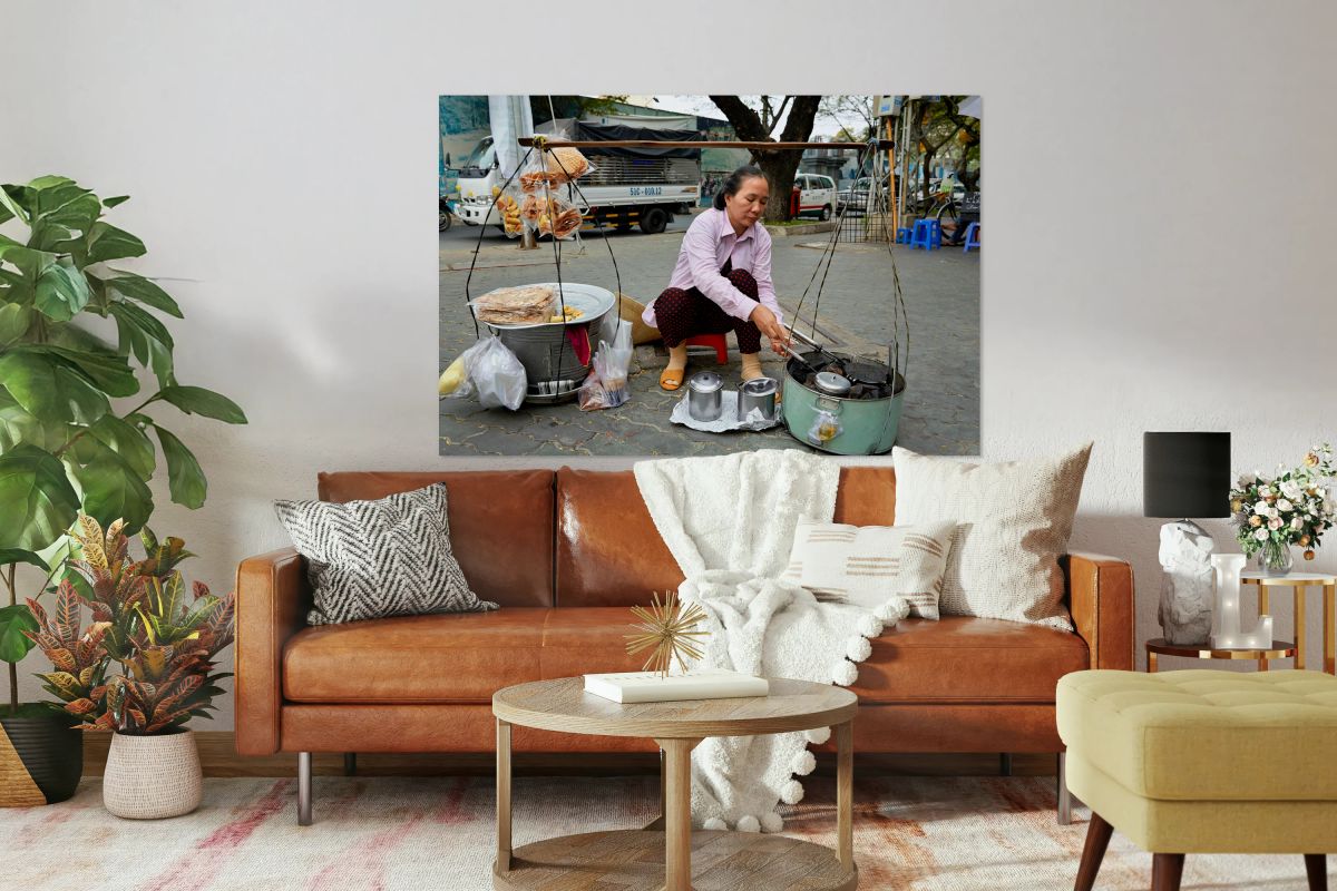 Local vendor preparing street food in Ho Chi Minh City Vietnam