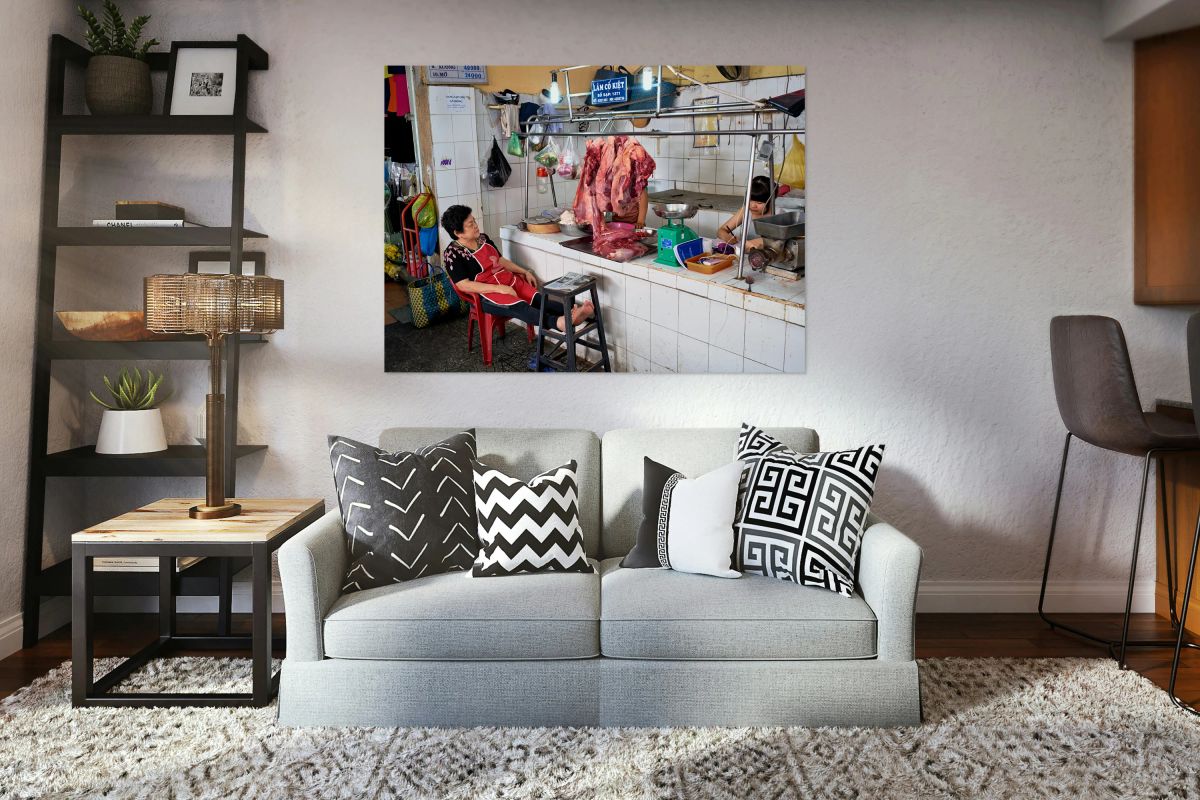 Market scene in Ho Chi Minh City with meat vendor and customer