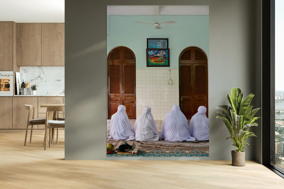 Muslim women pray in a room in Ho Chi Minh City